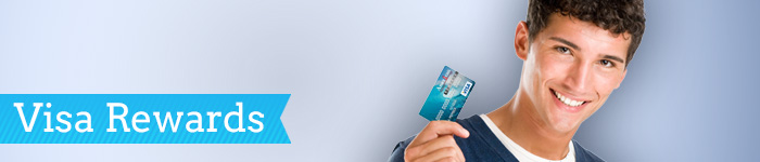 A man holding a credit card. American 1 Visa rewards credit card.