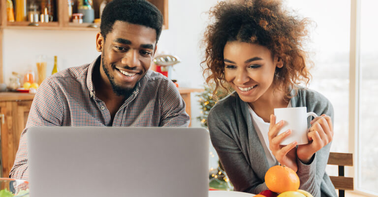 Couple looking at laptop