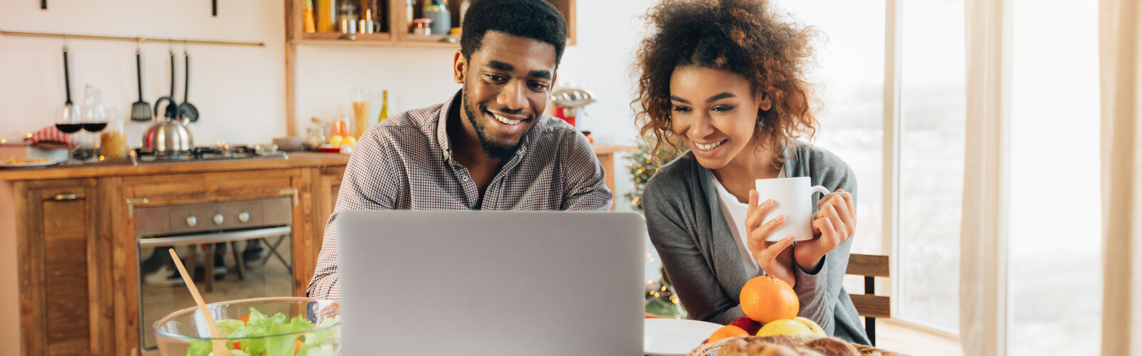 Couple in front of a laptop