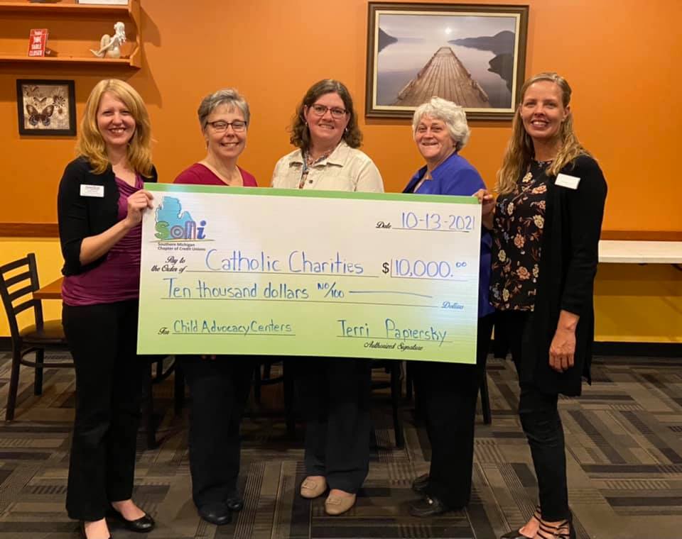 Catholic Charities $10,000 check donation